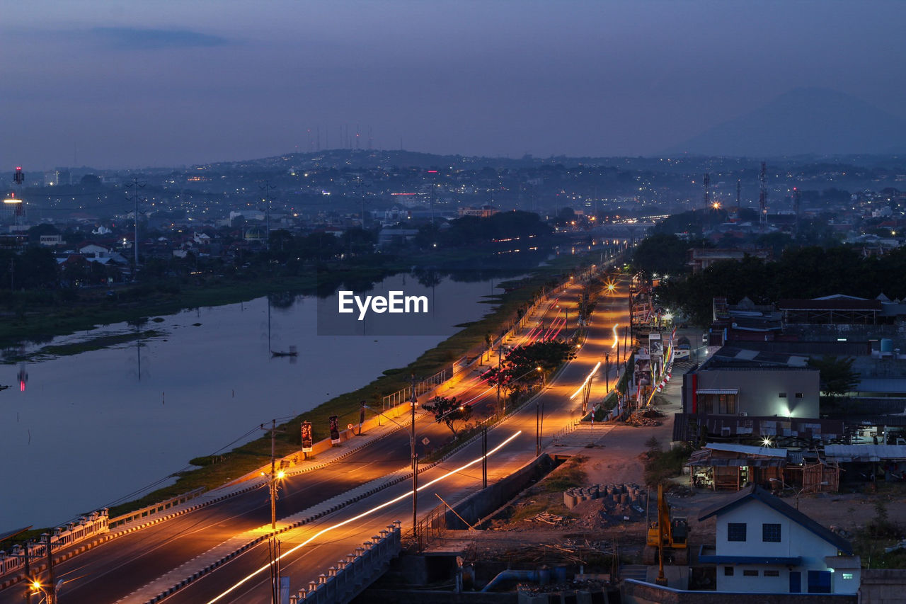 High angle view of illuminated city buildings at night