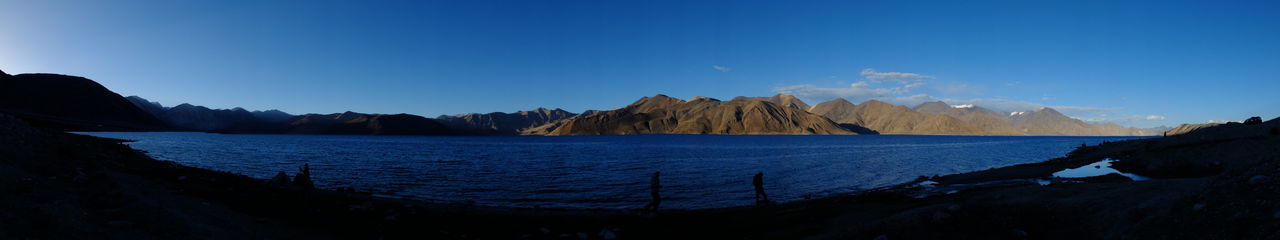 PANORAMIC VIEW OF LAKE AGAINST CLEAR BLUE SKY