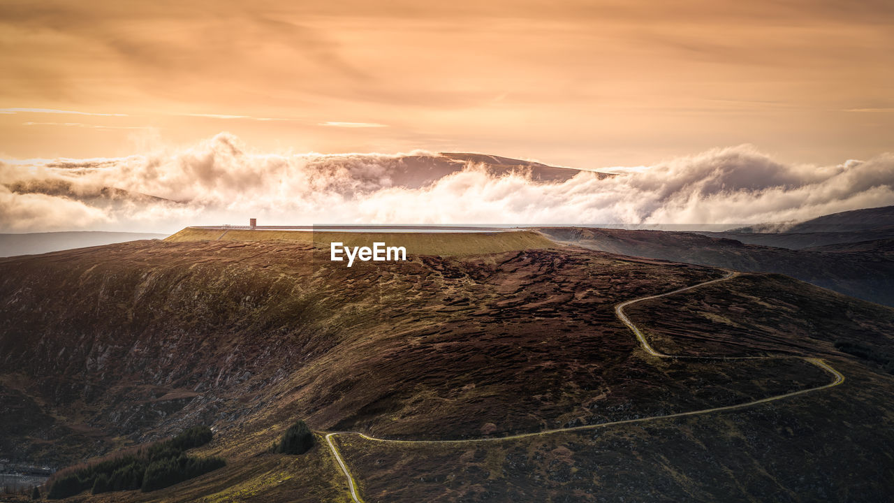 Scenic view of landscape against sky during sunset