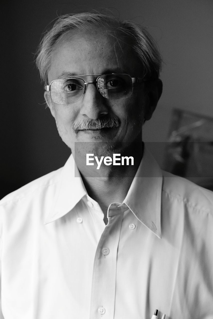 Close-up portrait of mature man wearing eyeglasses