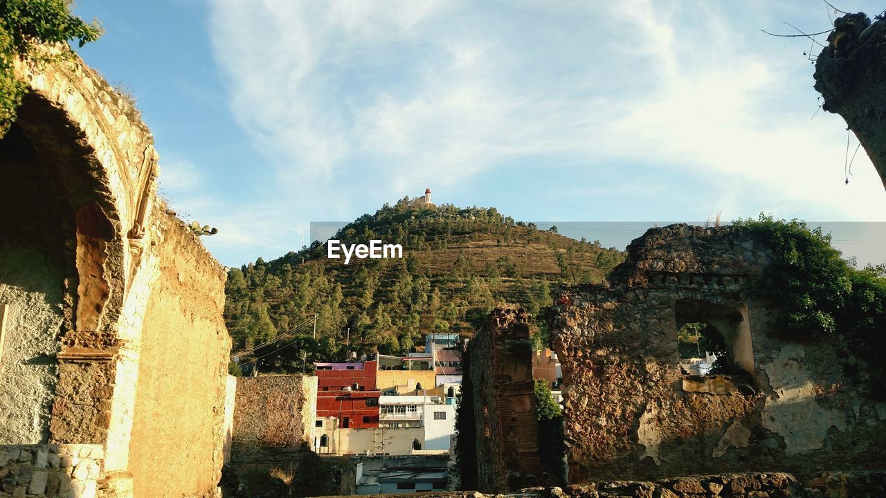 Low angle view of old ruins against sky