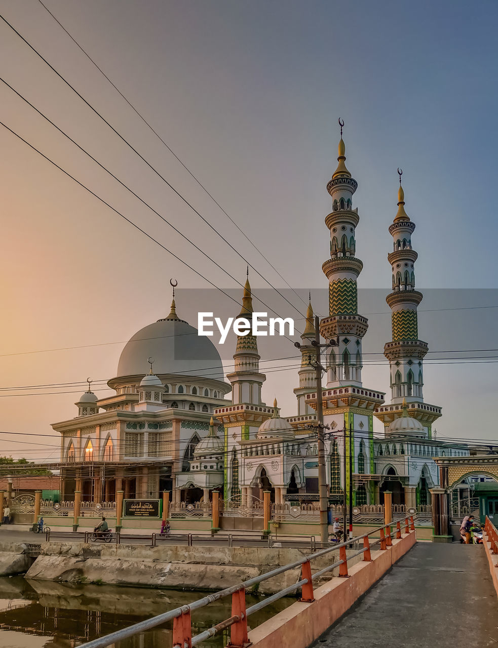 Mosque against sky during sunset