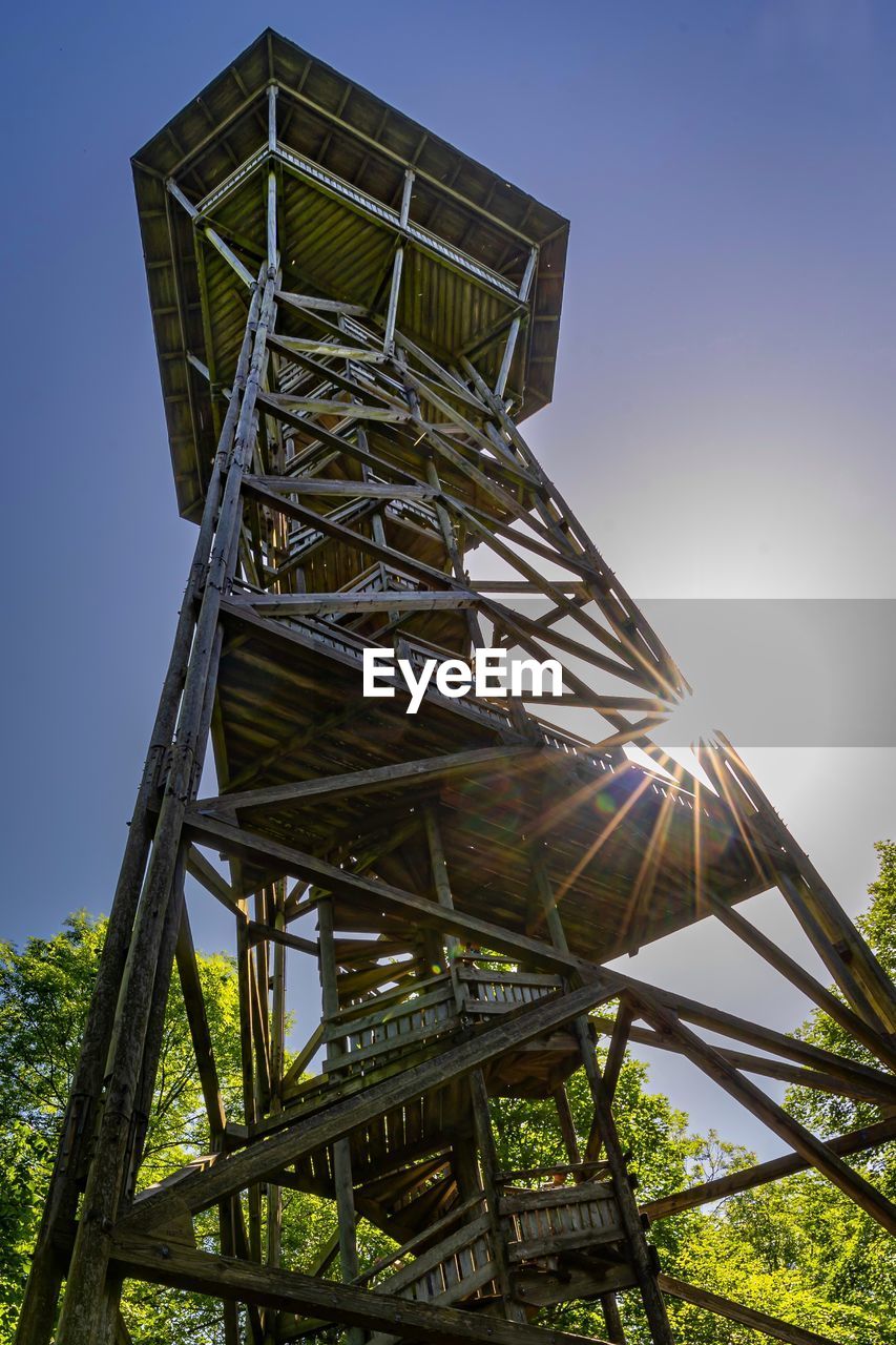 Low angle view of wood structure against sky 