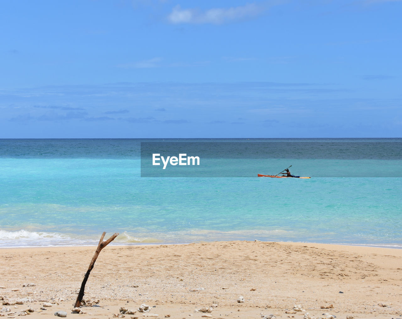 Scenic sea view of against sunny sky