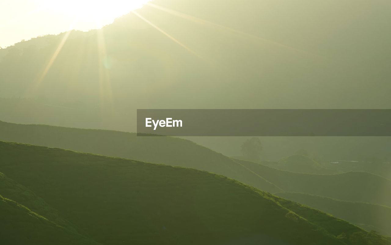 SUNLIGHT STREAMING THROUGH CLOUDS