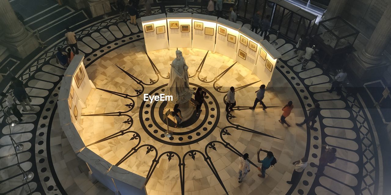 High angle view of people by statue