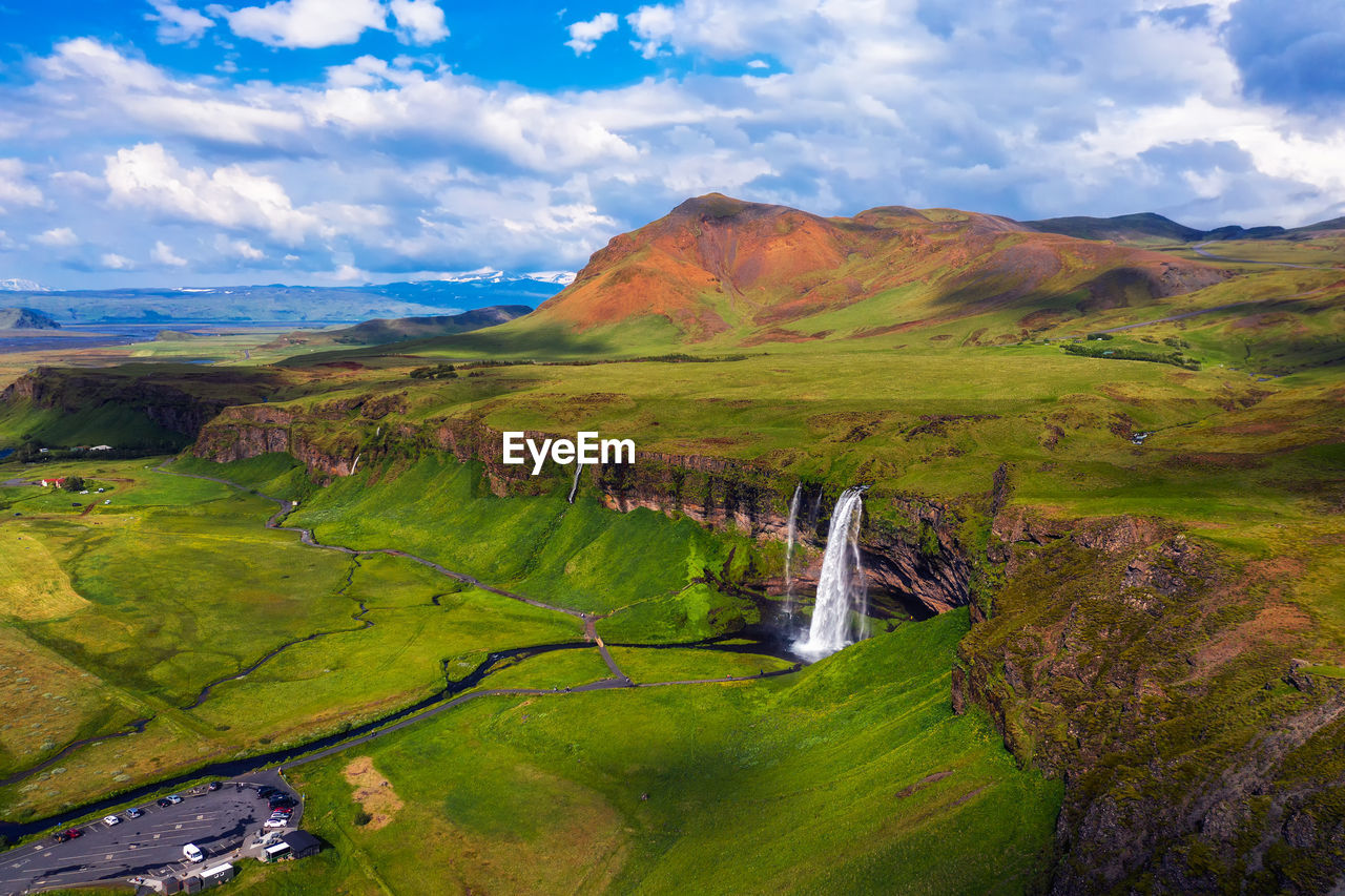 scenic view of agricultural landscape against sky