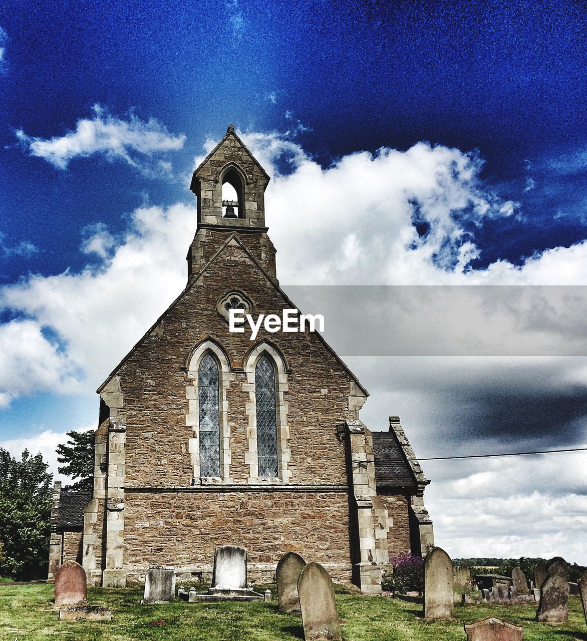 Old church and cemetery against sky