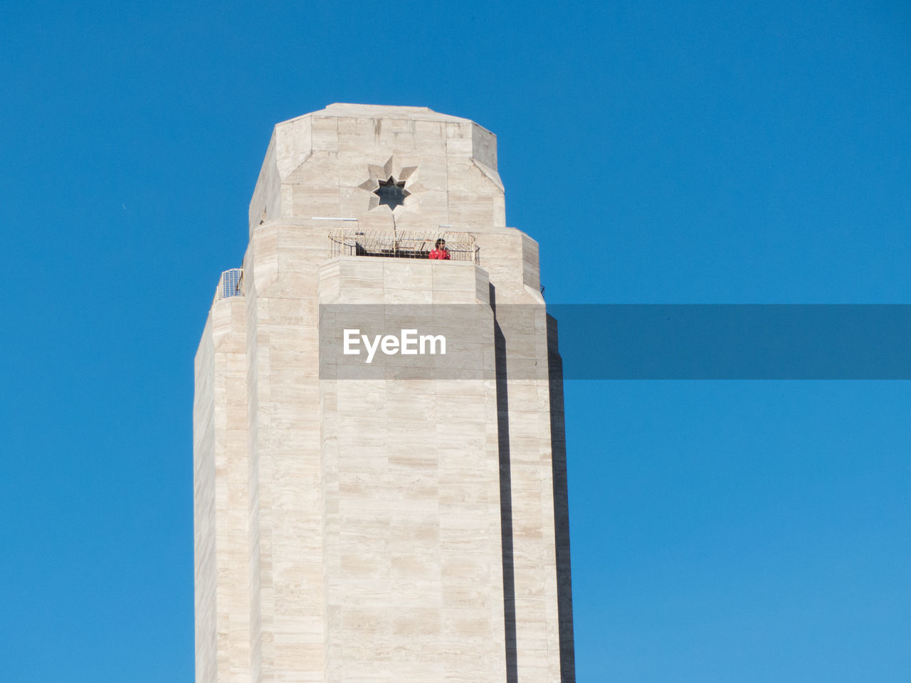 Low angle view of building against clear blue sky