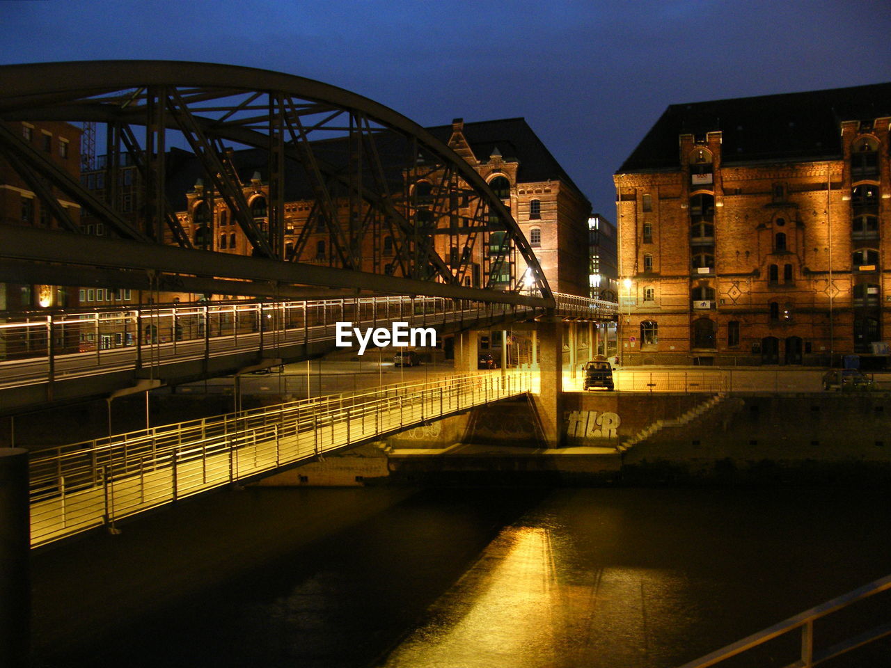 night, reflection, architecture, evening, built structure, bridge, transportation, cityscape, illuminated, light, water, building exterior, dusk, city, urban area, darkness, travel destinations, sky, nature, landmark, no people, river, travel, mode of transportation, outdoors, railing