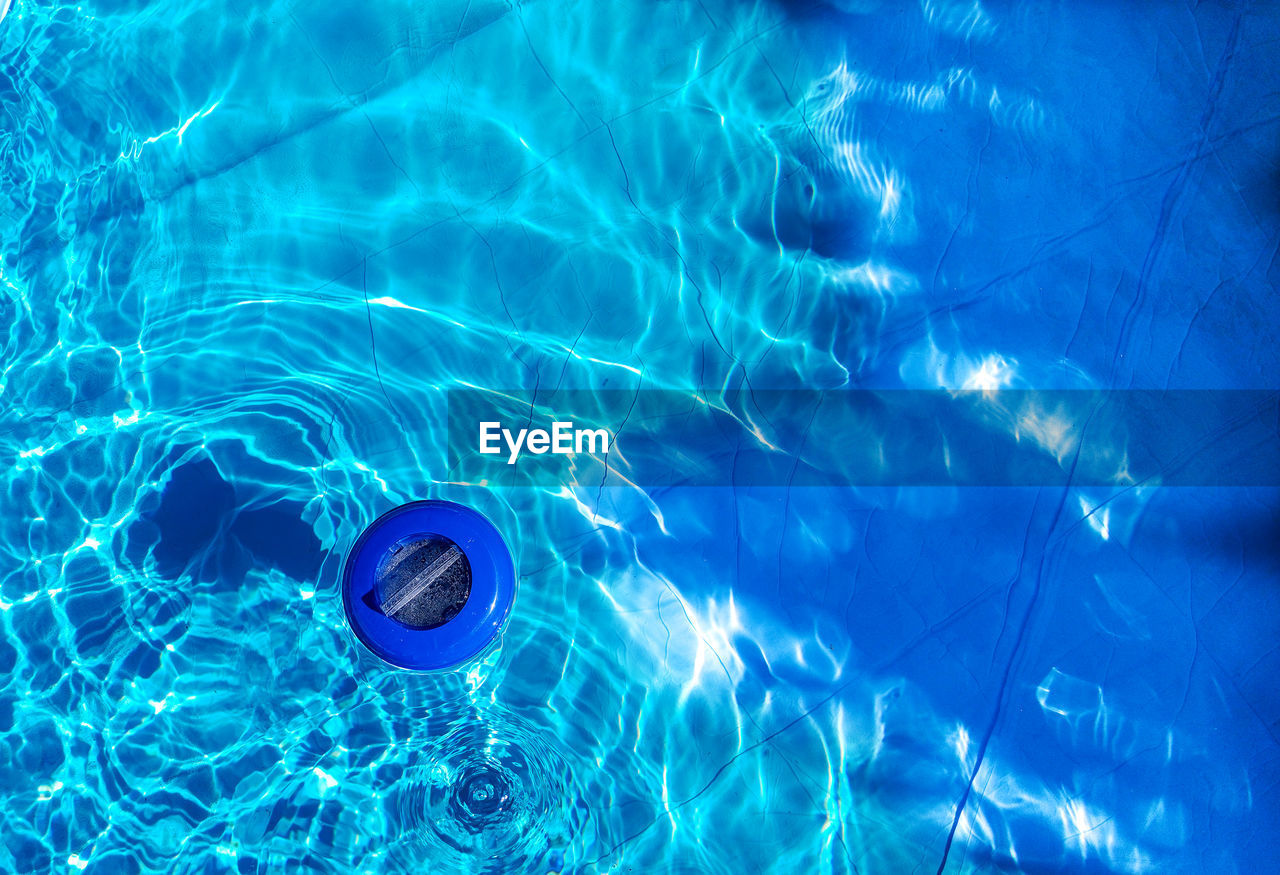 High angle view of cleaner in swimming pool