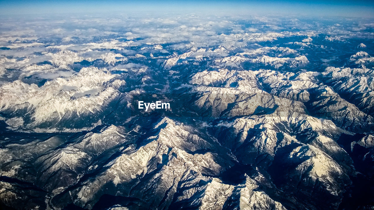 HIGH ANGLE VIEW OF AERIAL VIEW OF MOUNTAIN RANGE