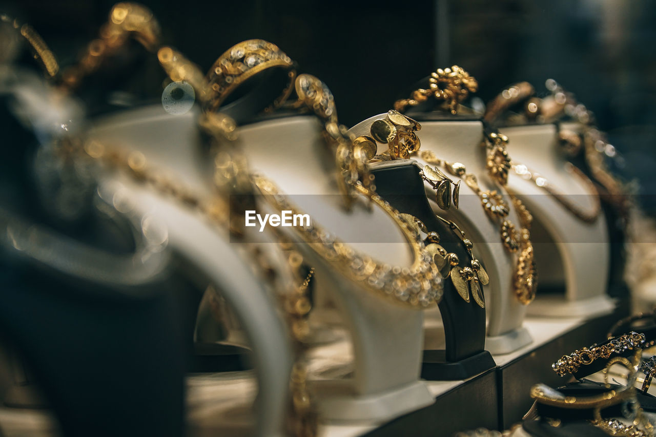 Close-up of necklaces on display at store