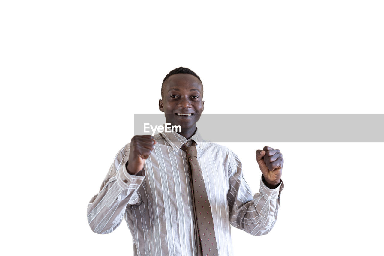 PORTRAIT OF A SMILING YOUNG MAN