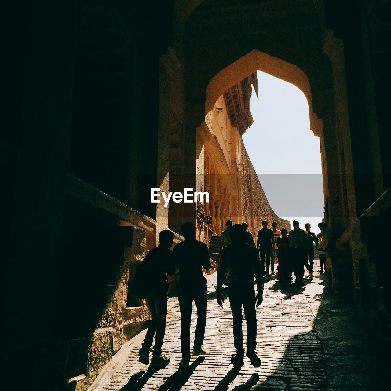 SILHOUETTE OF PEOPLE IN CORRIDOR