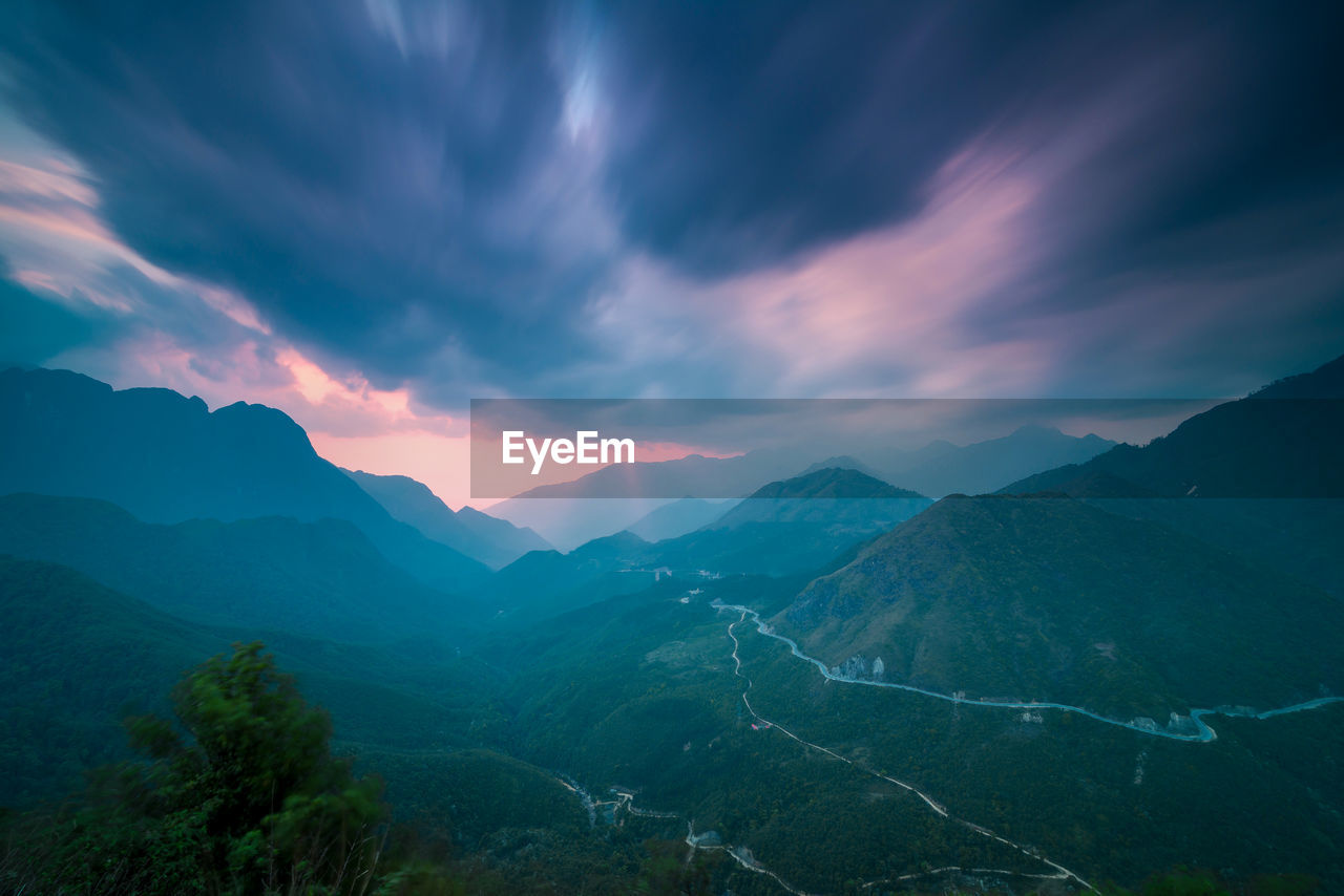 Scenic view of mountains against sky during sunset