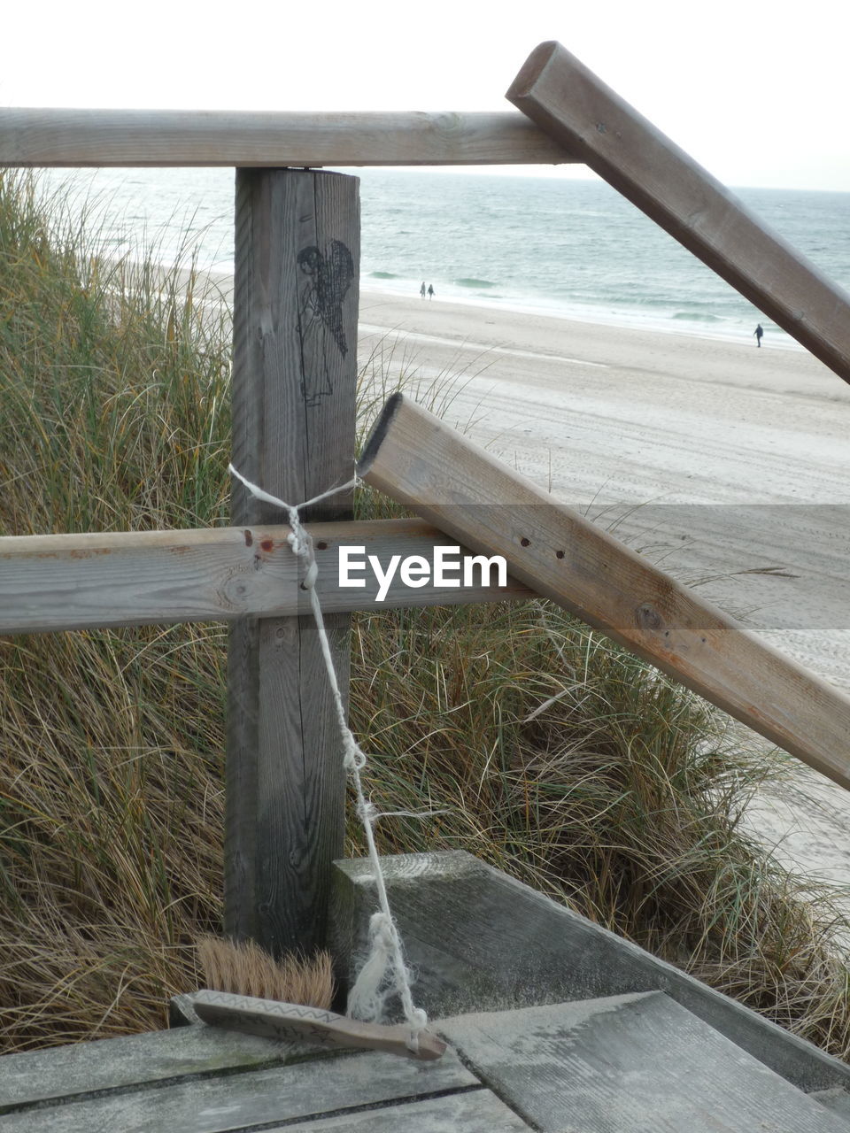 WOODEN POSTS IN SEA