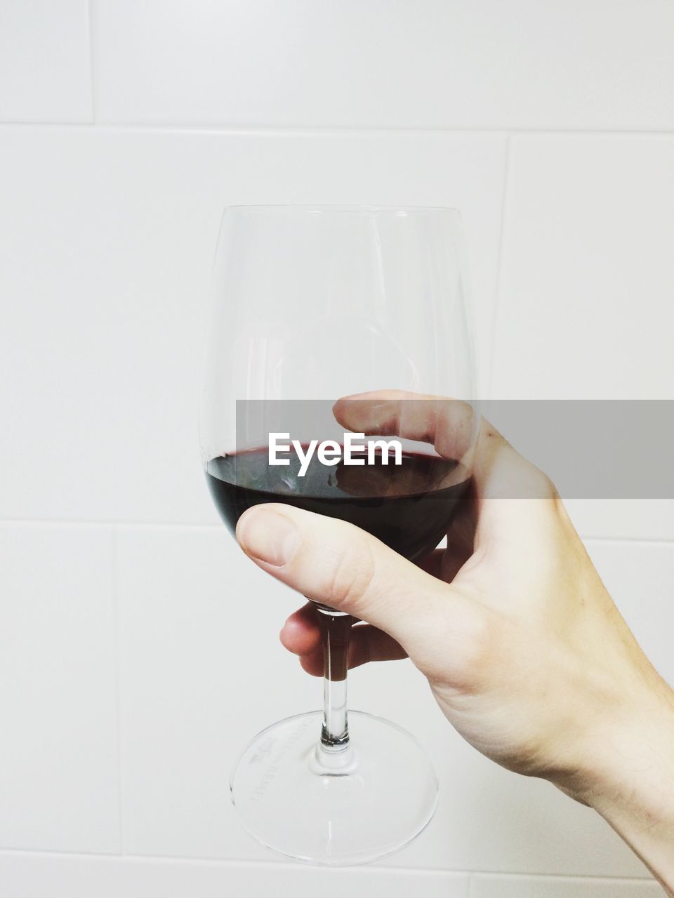 Cropped image of woman holding wineglass