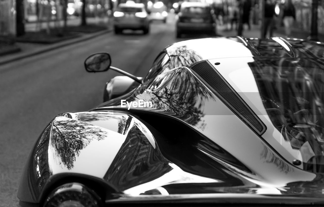 Close-up of car on street