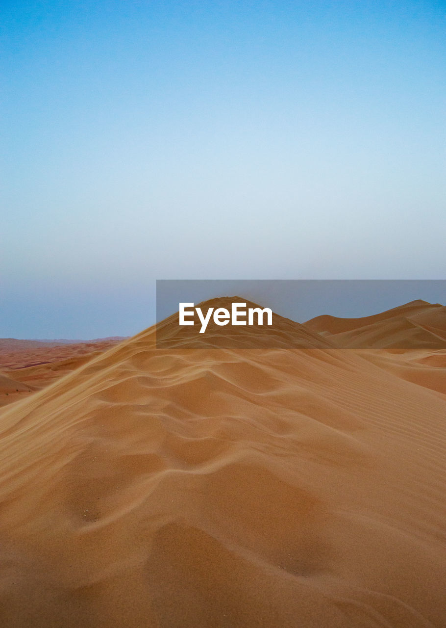 Scenic view of desert against clear sky