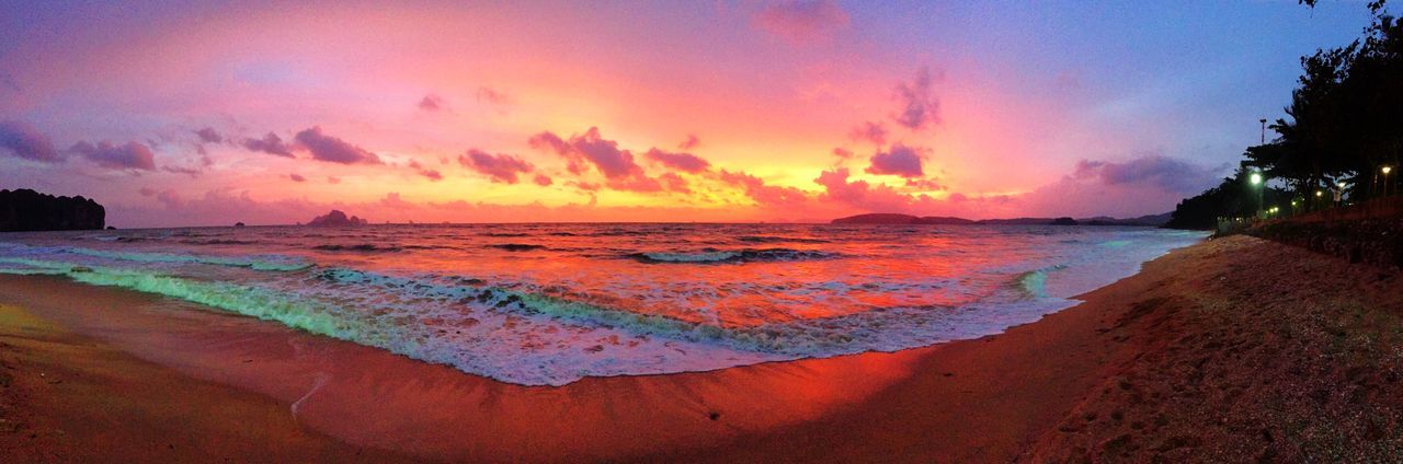 PANORAMIC SHOT OF BEACH AT SUNSET