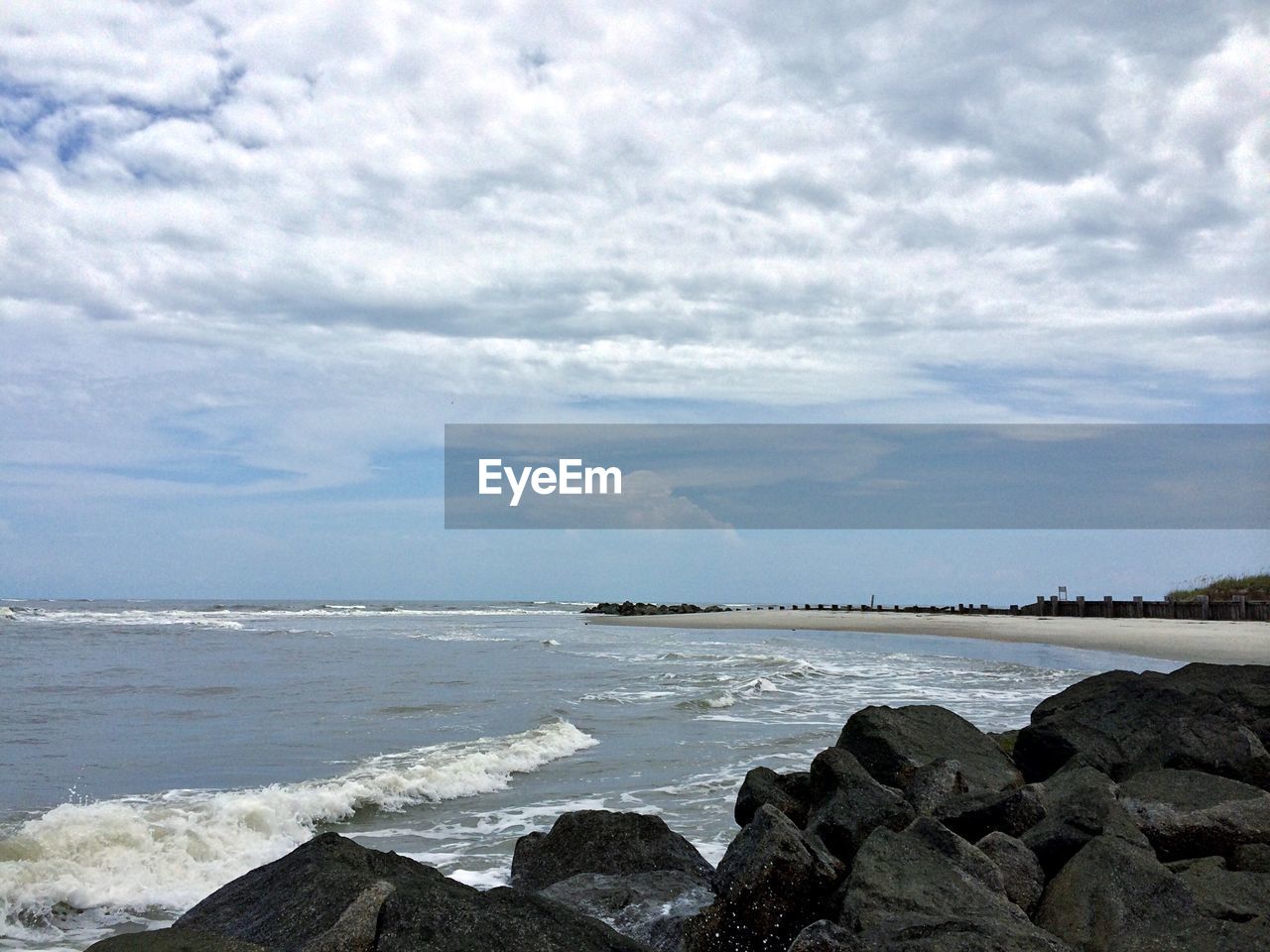 VIEW OF SEA AGAINST CLOUDY SKY