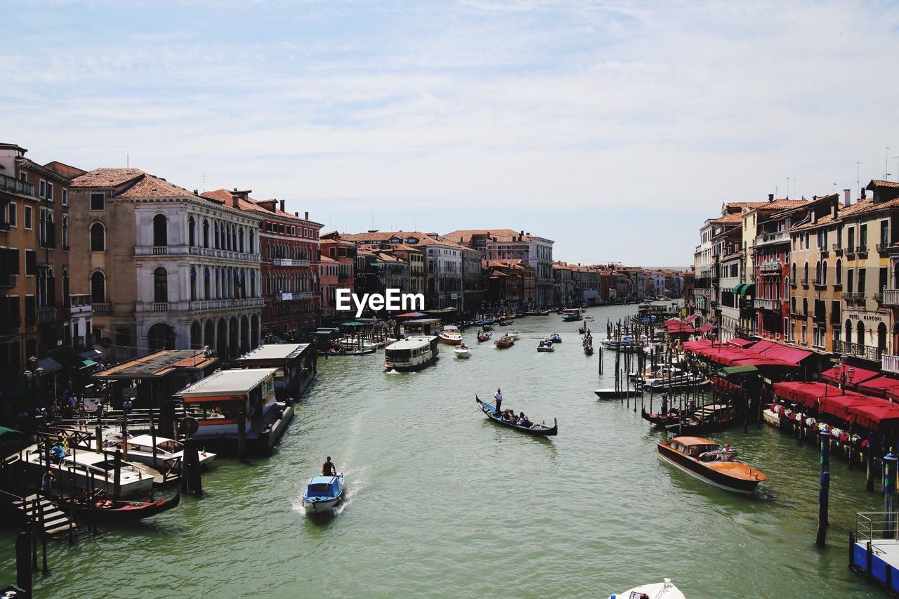 VIEW OF BOATS MOORED AT CANAL