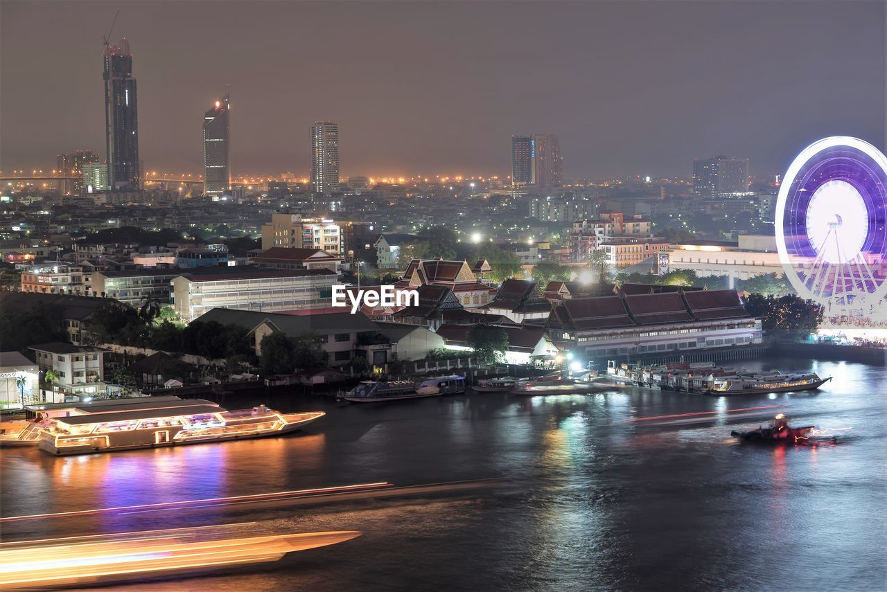 Illuminated buildings in city at night