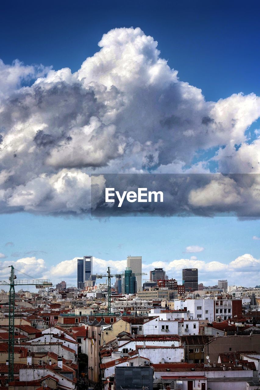 Buildings in city against sky