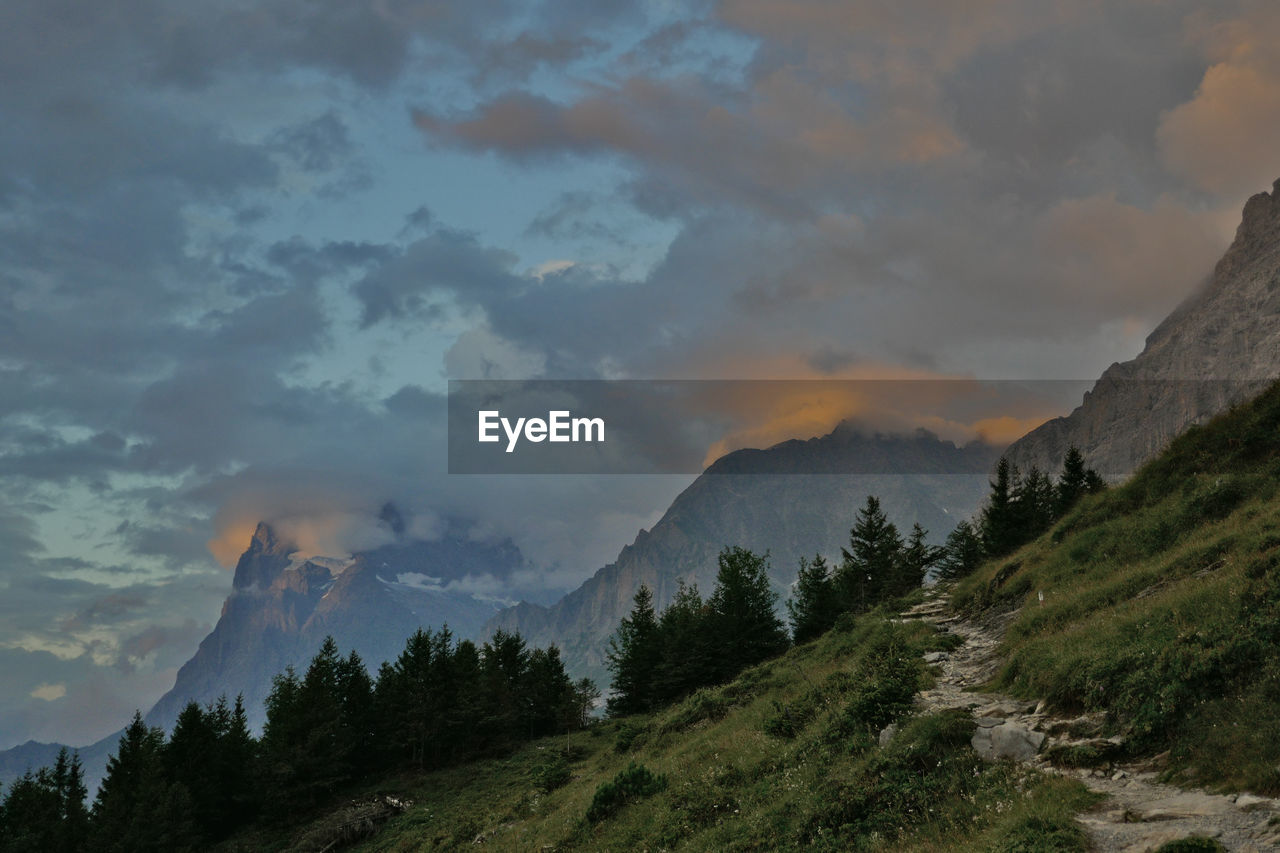 Scenic view of mountains against sky at sunset