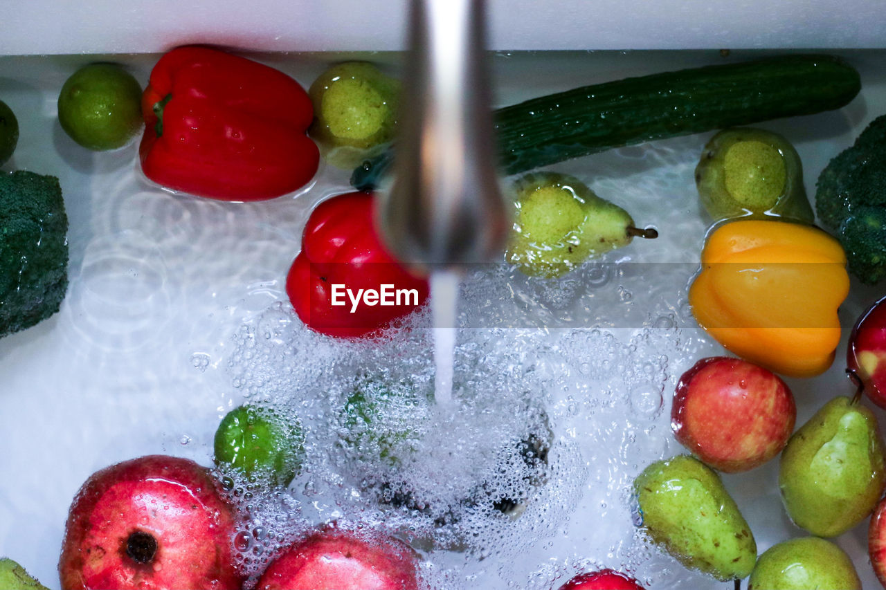High angle view of produce in sink filling u with water
