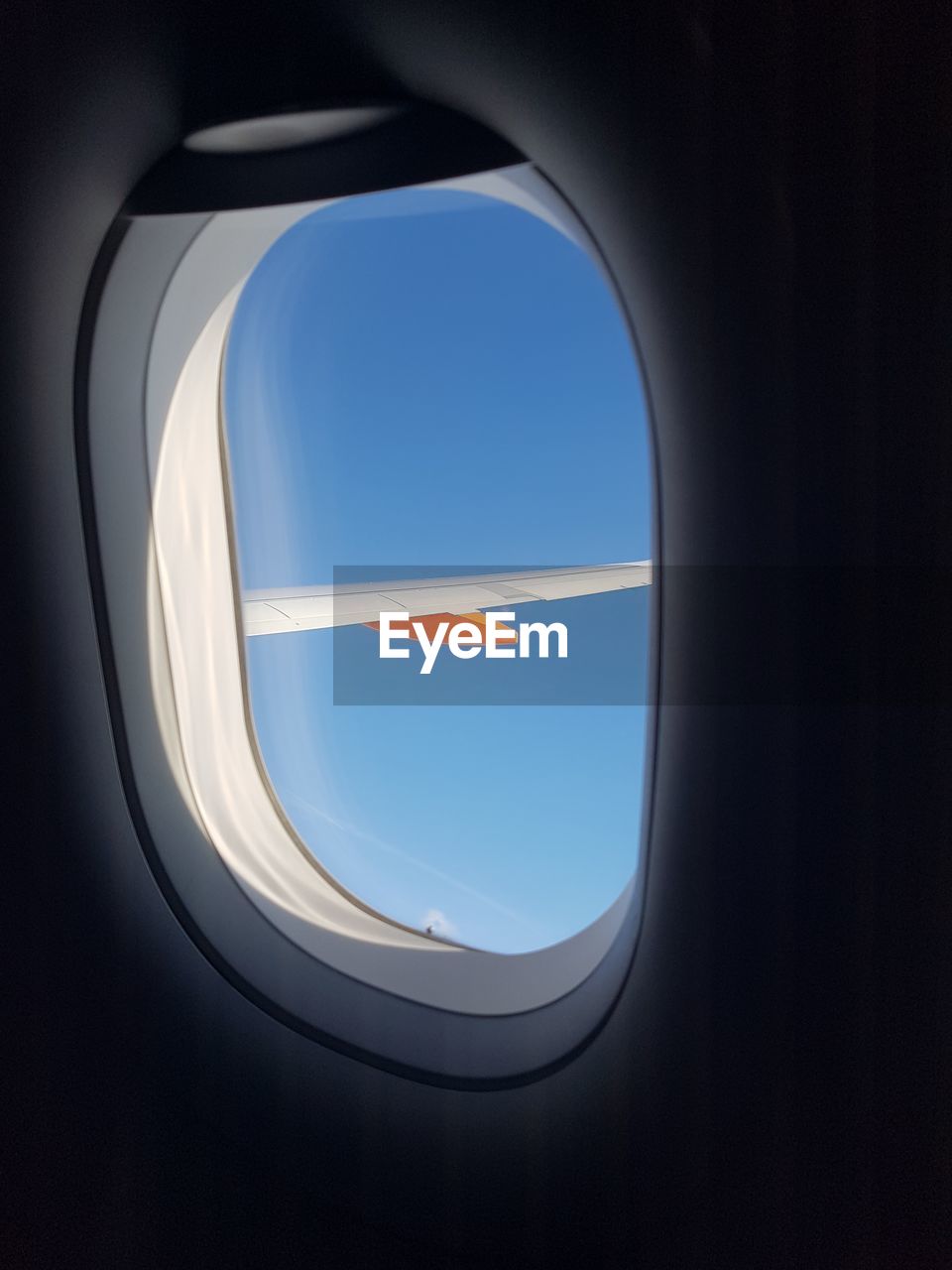 Aircraft wing seen through window