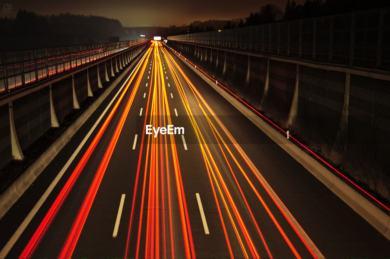 Light trails on road at night