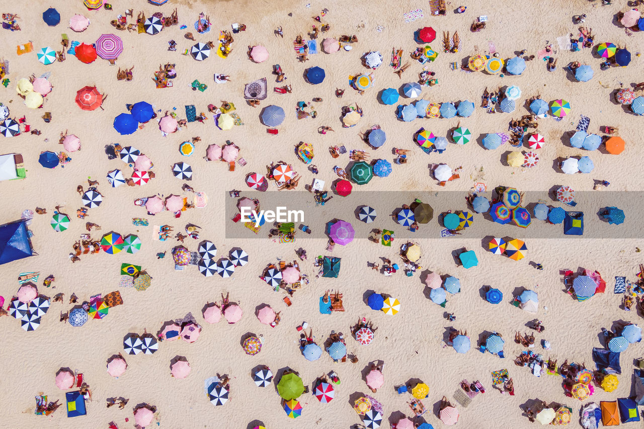 Aerial view of people enjoying on beach