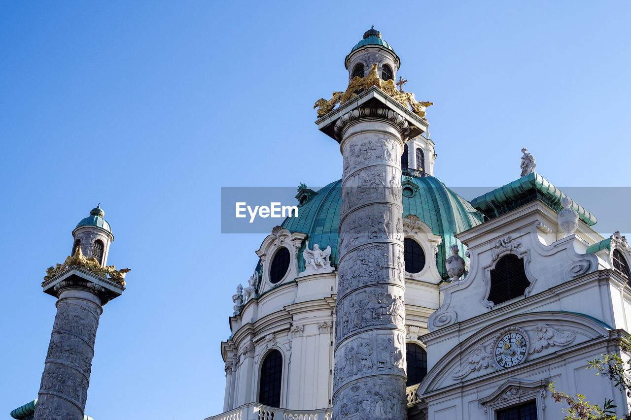 LOW ANGLE VIEW OF A CLOCK TOWER