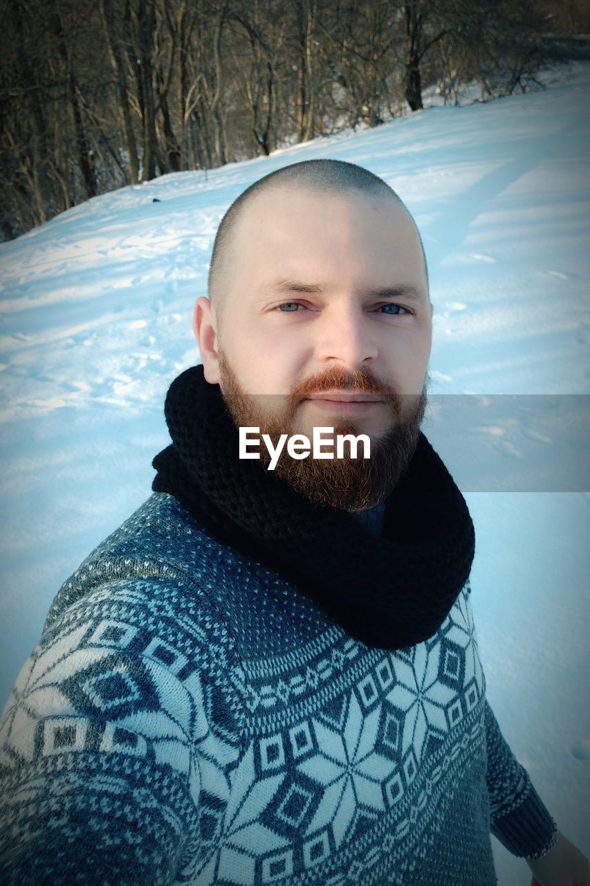 PORTRAIT OF MAN WITH SNOW IN WINTER