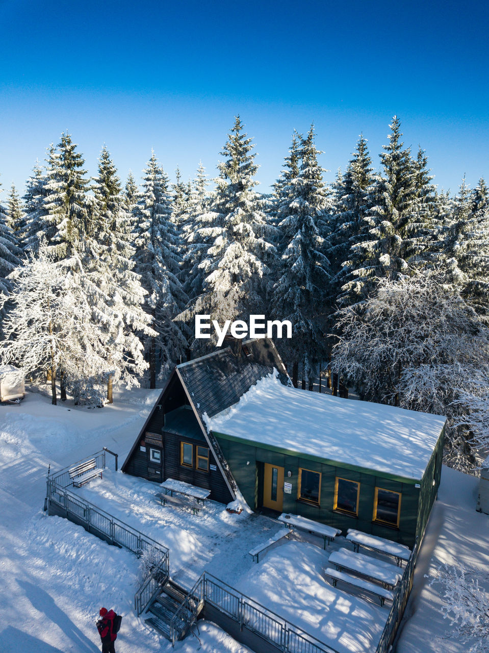 SNOW COVERED HOUSES AGAINST CLEAR SKY