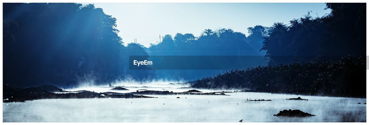 Panoramic view of lake against clear sky