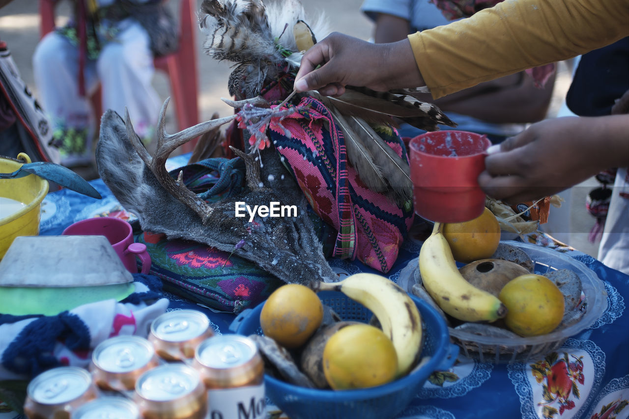 market, public space, food, food and drink, city, retail, hand, market stall, adult, healthy eating, business, fruit, vendor, freshness, business finance and industry, selling, abundance, women, one person, wellbeing, small business, holding, container, day, occupation, for sale, large group of objects, outdoors, buying, men