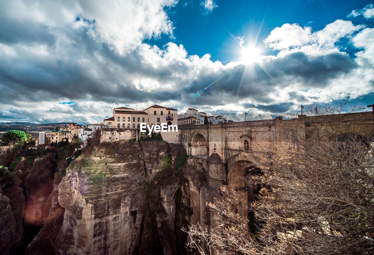 PANORAMIC SHOT OF HISTORIC BUILDINGS AGAINST CLOUDY SKY