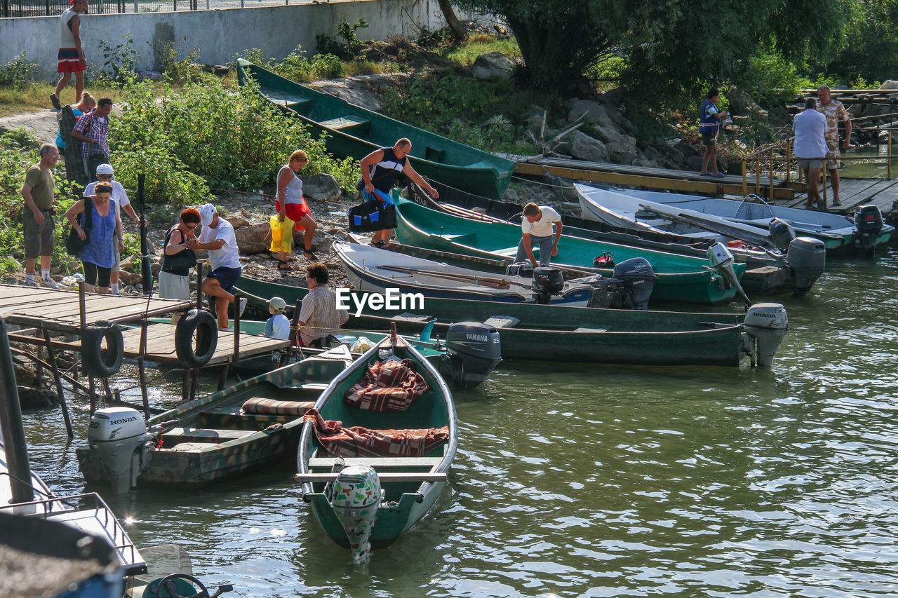 PEOPLE IN BOAT ON RIVER