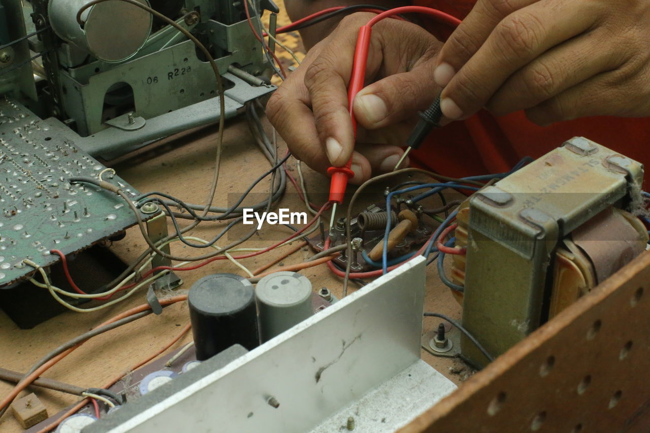 Cropped hands of man working in workshop