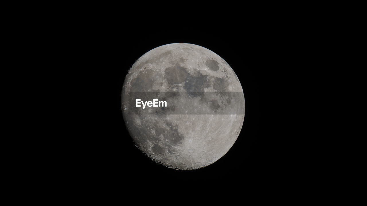 Scenic view of moon against clear sky at night