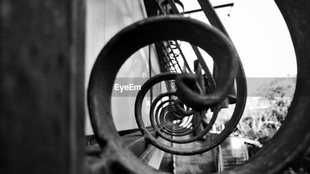 CLOSE-UP OF SPIRAL WHEEL AGAINST SKY