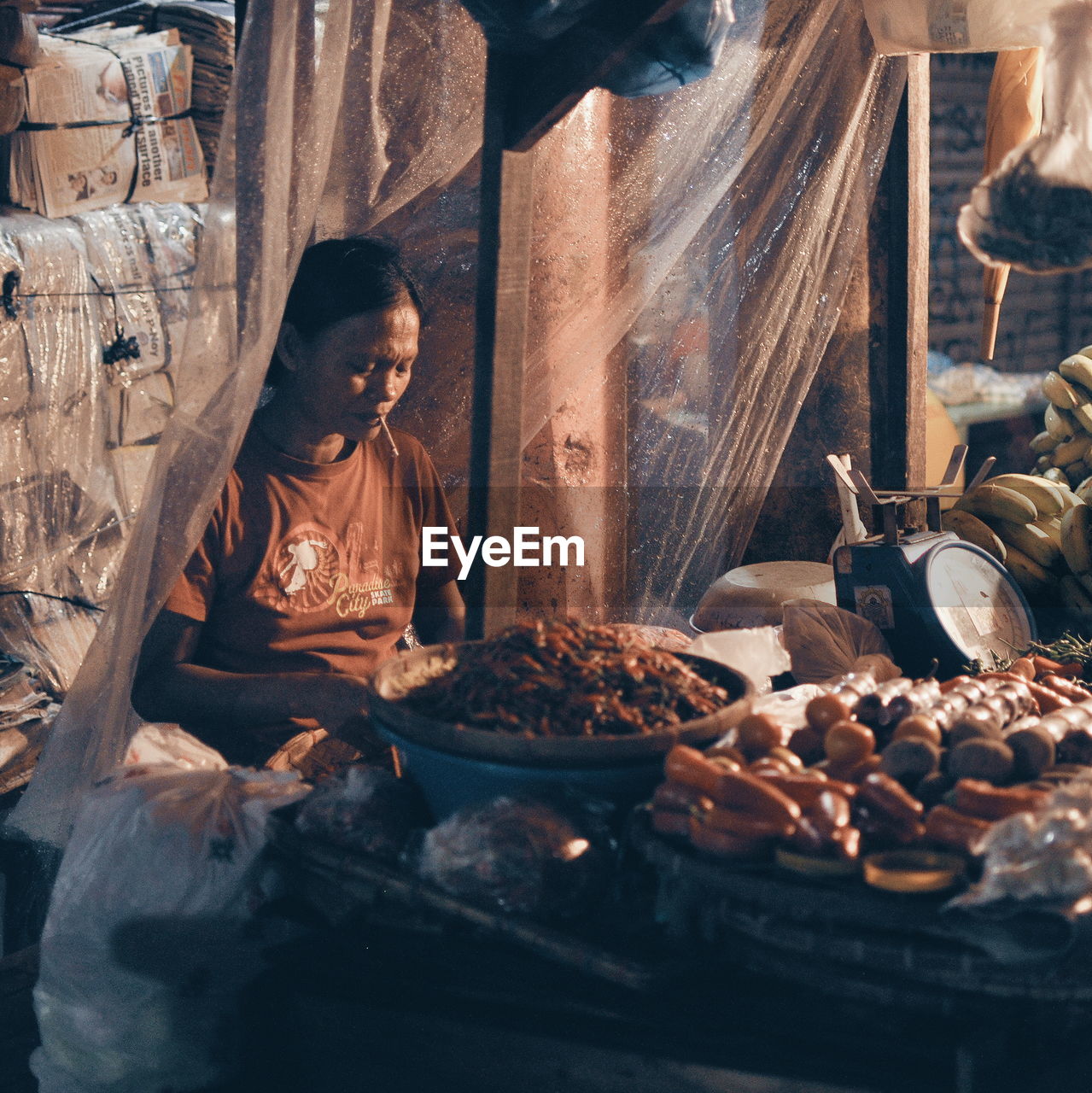 WOMAN WORKING IN MARKET