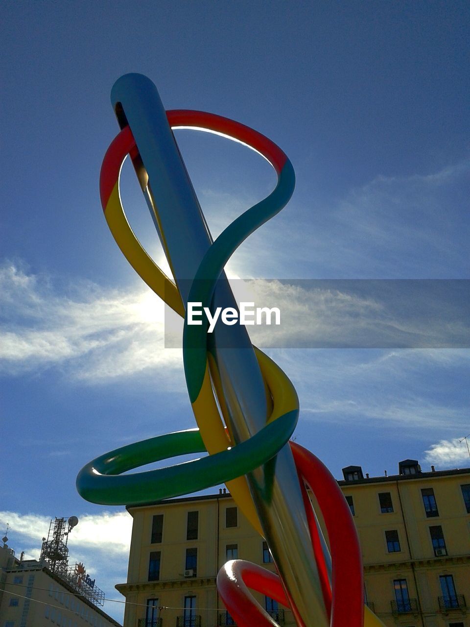 LOW ANGLE VIEW OF SCULPTURES AGAINST BLUE SKY