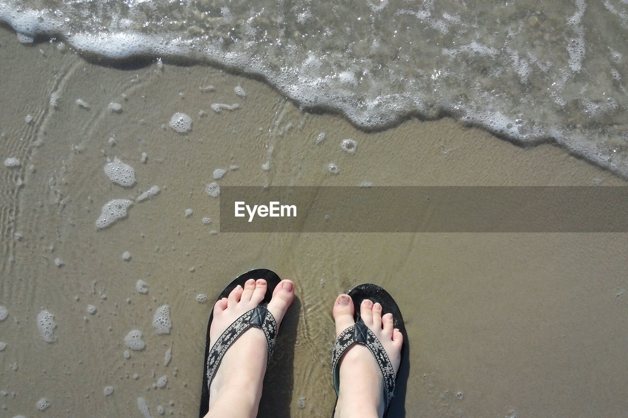 Low section of woman on beach