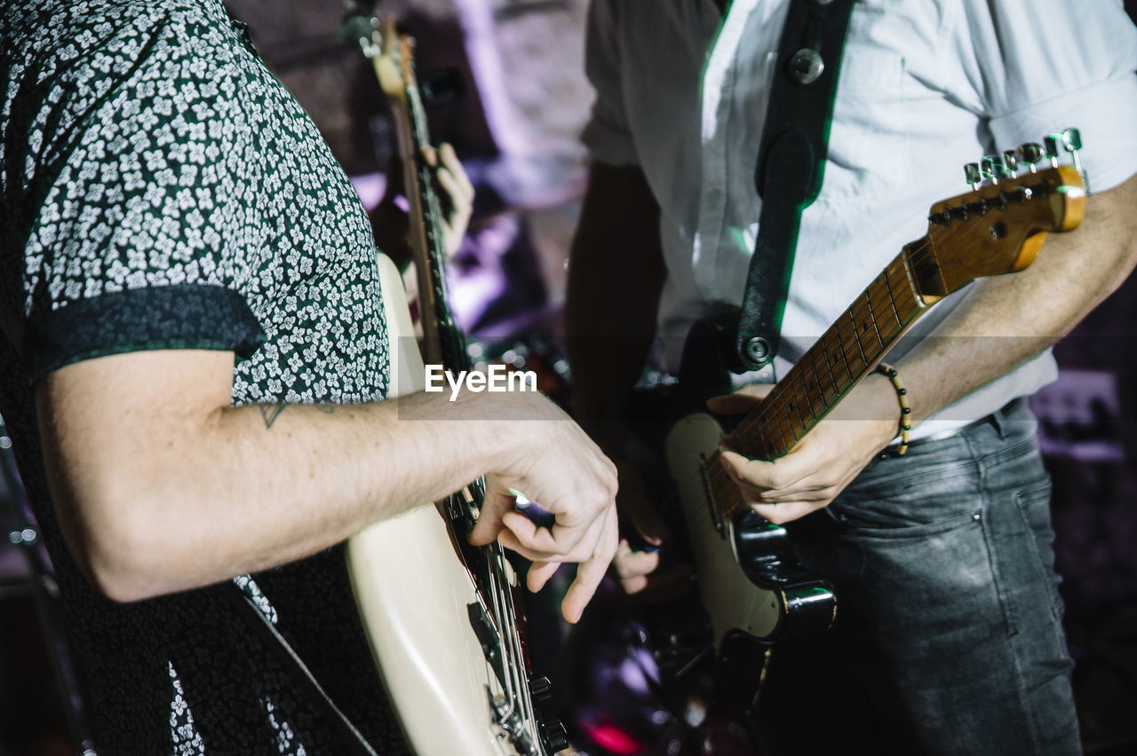 Blurred scene of musicians performing rock music on stage