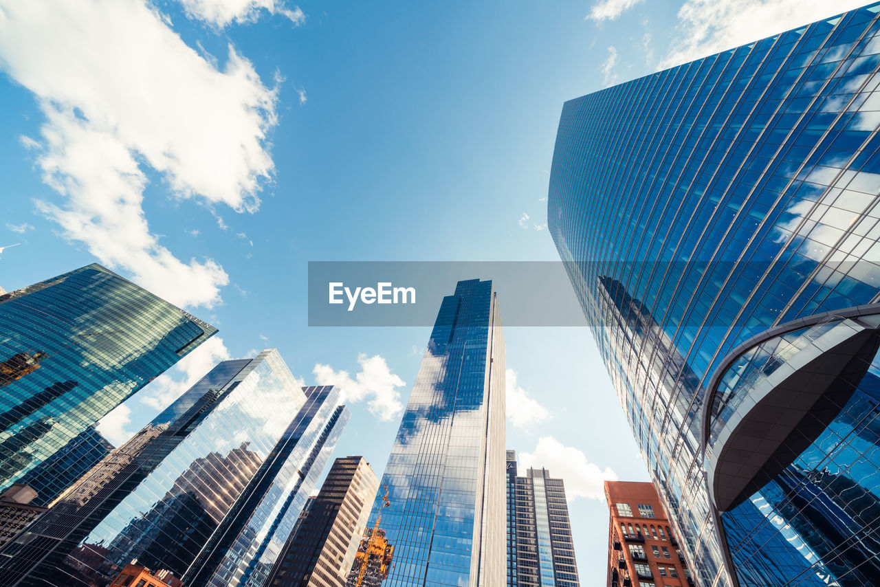 Low angle view of modern buildings against sky