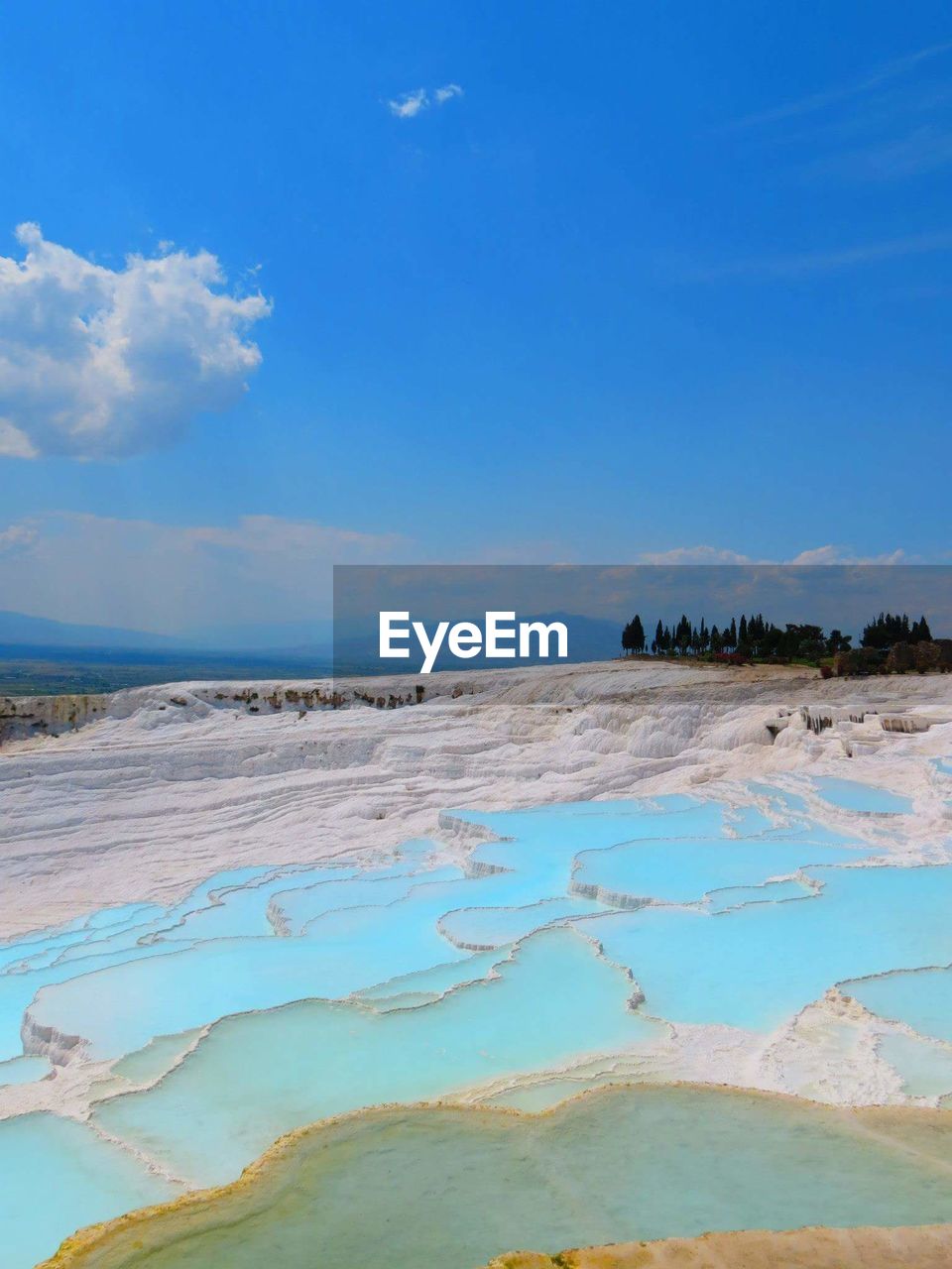 Terrace formations at pamukkale against sky